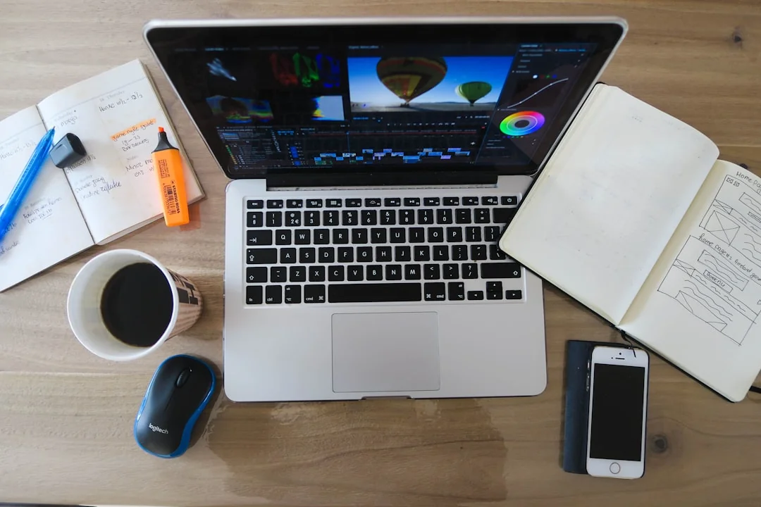 why-choose-us A modern workspace showing hands analyzing marketing data on a laptop and paper documents.
